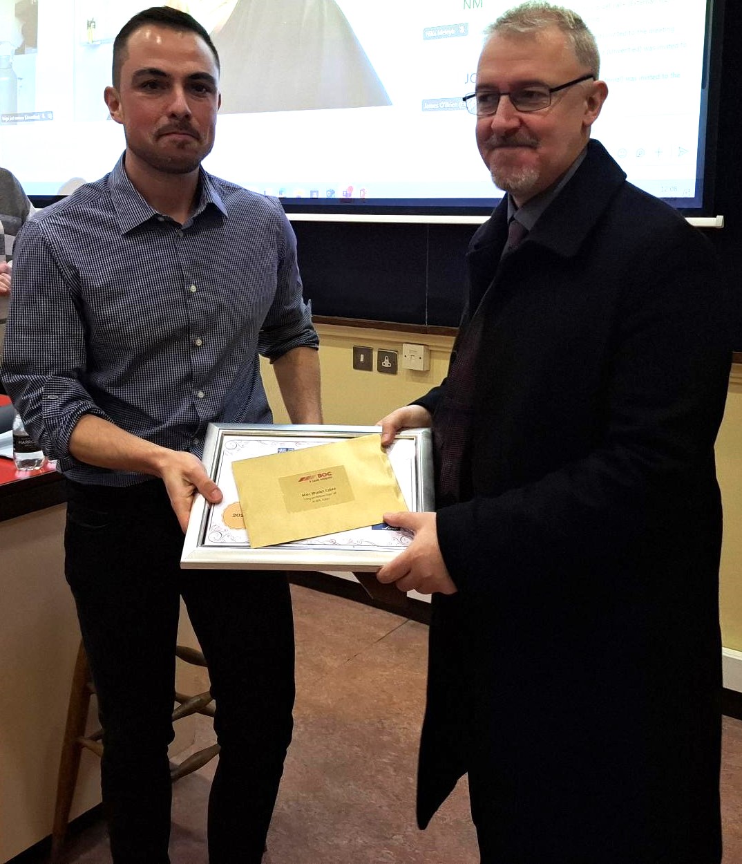 Marc Brunet Cabre is presented with his award by James Kelch from BOC Gases